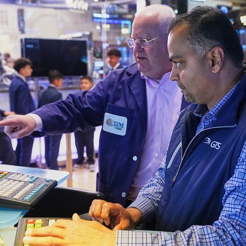 Trader Thomas Ferrigno, left, and specialist Dilip Patel work on the floor of the New York Stock Exchange, Thursday, April 23, 2026. (AP Photo/Richard Drew)