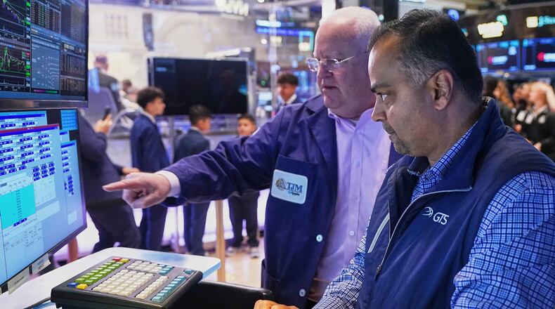 Trader Thomas Ferrigno, left, and specialist Dilip Patel work on the floor of the New York Stock Exchange, Thursday, April 23, 2026. (AP Photo/Richard Drew)