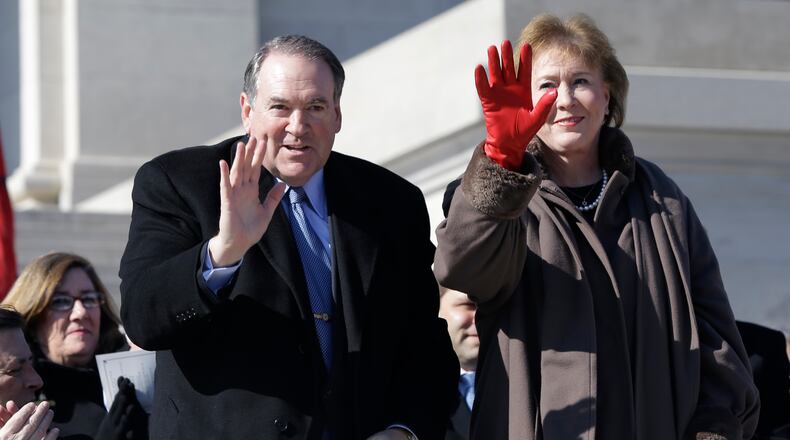 Former Arkansas Gov. Mike Huckbee, left, and his wife Janet wave as they are recognized at Arkansas Gov. Asa Hutchinson's inauguration ceremony at the Arkansas state Capitol in Little Rock, Ark., Tuesday, Jan. 13, 2015. (AP Photo/Danny Johnston) Former Arkansas Gov. Mike Huckbee, left, and his wife Janet wave as they are recognized at Arkansas Gov. Asa Hutchinson's inauguration ceremony at the Arkansas state capitol in Little Rock, Ark., last week. AP//Danny Johnston