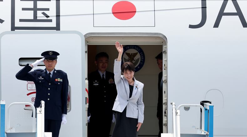 Japan's Prime Minister Sanae Takaichi waves upon arrival at the Daegu International Airport in Daegu, South Korea, Tuesday, May 19, 2026. (Yoon Kwan-shick/Yonhap via AP)