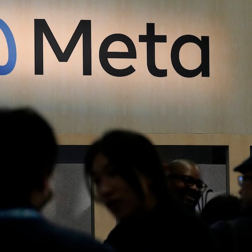 FILE - Attendees visit the Meta booth at the Game Developers Conference 2023 in San Francisco on March 22, 2023. (AP Photo/Jeff Chiu, File)