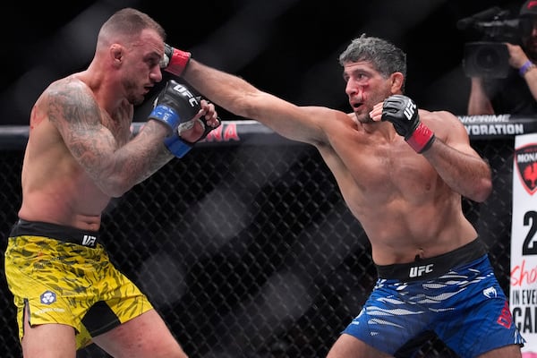 Beneil Dariush hits Renato Moicano in a lightweight fight at UFC 317, Saturday, June 28, 2025, in Las Vegas. (AP Photo/John Locher)