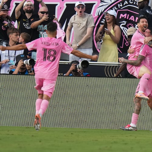 Inter Miami midfielder Rodrigo de Paul (7) celebrates a goal with forward Lionel Messi (10) and defender Jordi Alba (18) during the second half of the MLS Cup final soccer match against the Vancouver Whitecaps Saturday, Dec. 6, 2025, in Fort Lauderdale, Fla. (AP Photo/Lynne Sladky)