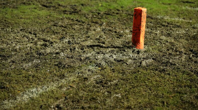 Mud surrounds the goal line pylon at Marietta's Northcutt Stadium (Jason Getz/Special)