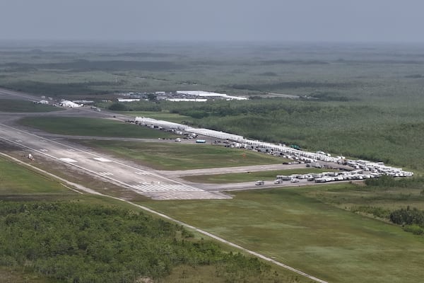 This aerial photo shows that the state is plowing ahead with building a an immigration detention facility with heavy-duty tents, trailers and other temporary buildings at the Miami Dade County-owned airfield in the Big Cypress National Preserve, about 45 miles (72 kilometers) west of downtown Miami, This Friday, June 27, 2025. (AP Photo/Daniel Kozin)