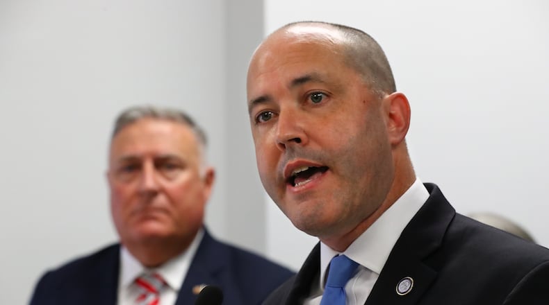 062722 Atlanta: Attorney General Chris Carr speaks with Insurance Commissioner John King looking on during a joint press conference on Wednesday, June 29, 2022, in Atlanta. The attorney general has recently weighed in on Cobb County's move to amend its own district map, saying it is "not legally binding." “Curtis Compton / Curtis.Compton@ajc.com"