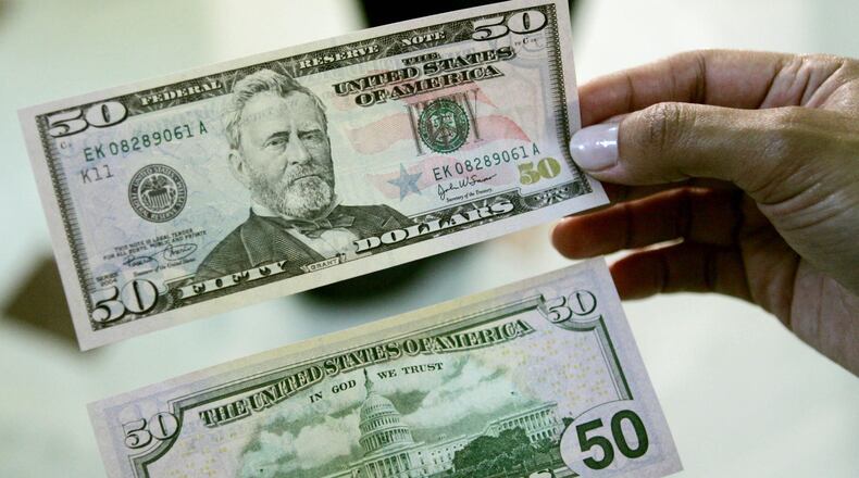 A Colorado teacher received two $50 bills from a stranger during her second job as a grocery store clerk.