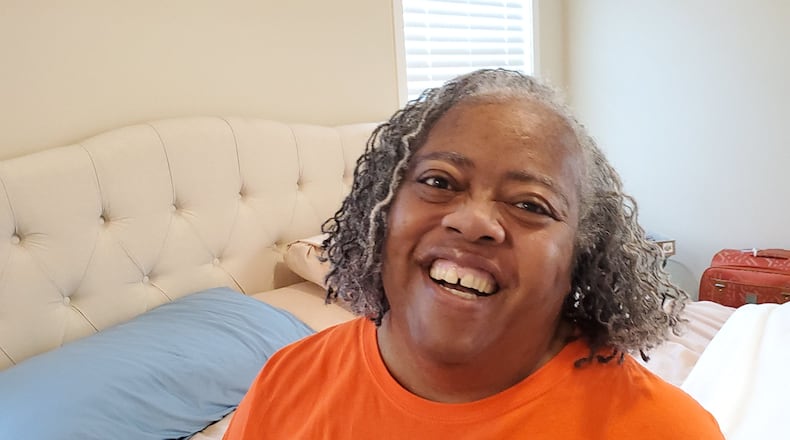 Janice Cockfield laughs at home in South Fulton while joking around with her sister Janese, who had just combed Janice's hair in preparation for going to physical therapy on September 1, 2020. Janice, a Delta Air Lines customer experience specialist, stunned her Emory University Hospital Midtown medical team by surviving COVID-19 after being hospitalized for 110 days, with more than two months spent in the ICU, most of that time on a ventilator. She returned home on July 17. (credit: Janese Cockfield / Contributed)