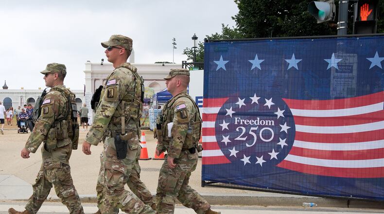 Soldiers from the Mississippi National Guard patrol along the Great American State Fair on the National Mall, Monday, July 6, 2026, in Washington. (AP Photo/Jacquelyn Martin)