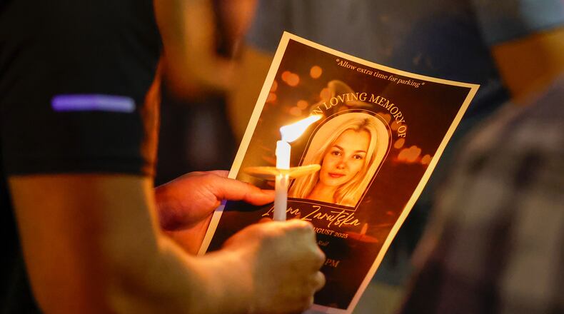 FILE - Community members gather for a vigil honoring the life of Iryna Zarutska, a Ukranian refugee, who was fatally stabbed on a commuter train, Sept. 22, 2025, in Charlotte, N.C. (AP Photo/Nell Redmond, File)