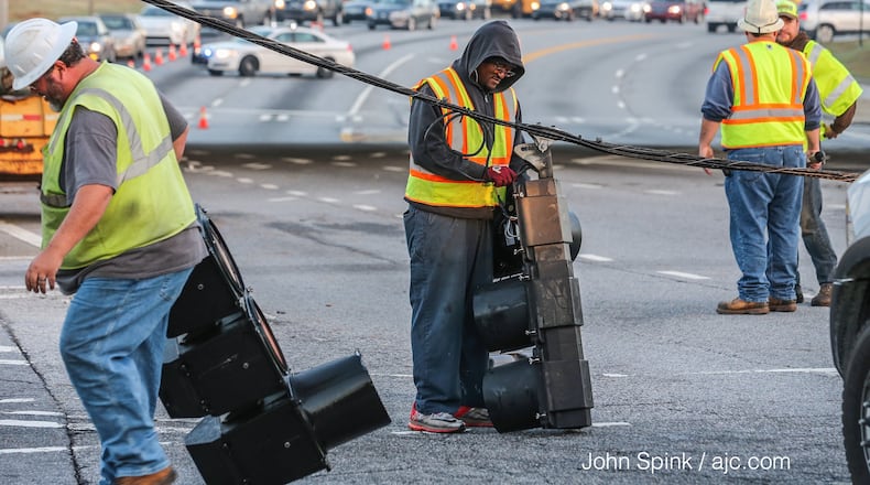 A crash shut down the  intersection of Jimmy Carter and Peachtree Industrial boulevards Thursday. JOHN SPINK / JSPINK@AJC.COM