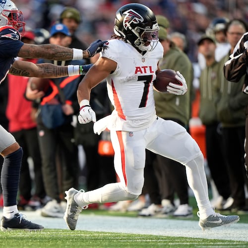 Atlanta Falcons running back Bijan Robinson (7) runs against the New England Patriots during the second half of an NFL football game, Sunday, Nov. 2, 2025, in Foxborough, Mass. (AP Photo/Robert F. Bukaty)