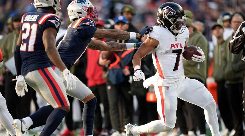Atlanta Falcons running back Bijan Robinson (7) runs against the New England Patriots during the second half of an NFL football game, Sunday, Nov. 2, 2025, in Foxborough, Mass. (AP Photo/Robert F. Bukaty)