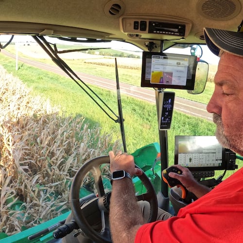 Farmer Jason Kurtz harvests corn Tuesday, Sept. 8, 2026, near Forest City, Mo. (AP Photo/Nick Ingram)