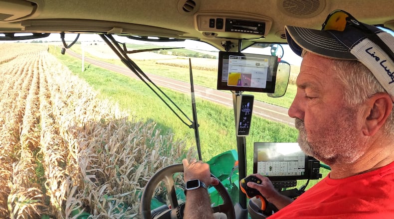Farmer Jason Kurtz harvests corn Tuesday, Sept. 8, 2026, near Forest City, Mo. (AP Photo/Nick Ingram)