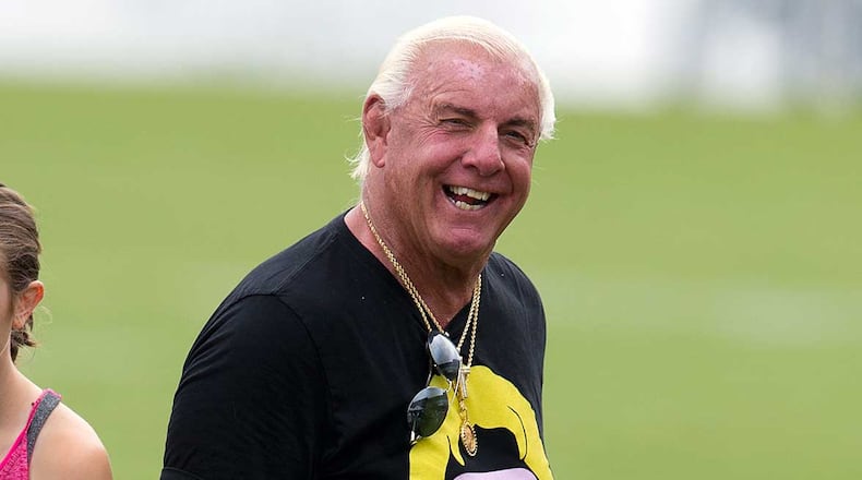 Pro wrestler 'Nature Boy' Ric Flair is all smiles during his visit to Falcons training camp Wednesday.