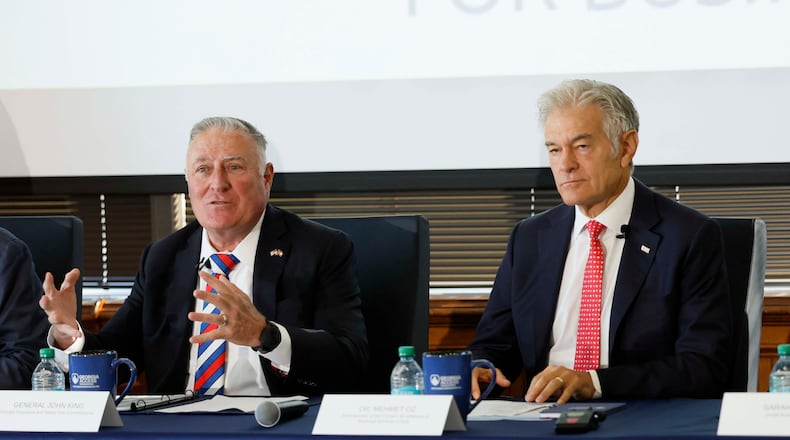 Georgia Insurance and Safety Fire Commissioner John King, left, and Medicare & Medicaid Services Administrator Dr. Mehmet Oz speak during roundtable with health leaders on Monday in Atlanta. (Miguel Martinez/AJC)
