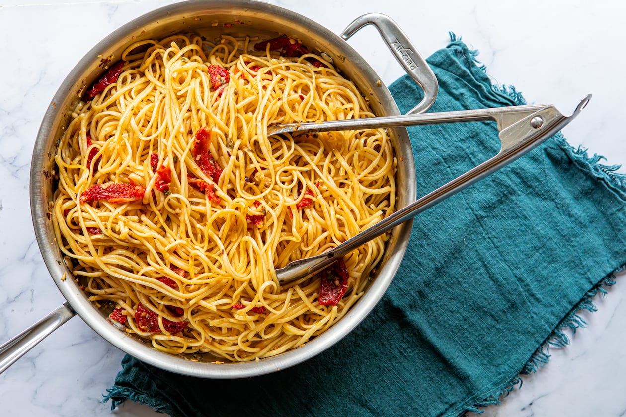 Spicy Sun-Dried Tomato Pasta includes garlic, capers and red pepper flakes. (Aaliyah Man for the AJC/food styling by Kate Williams)