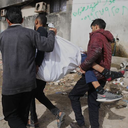 Palestinians carry the body of Mohammad Zawara, 15, who was killed in an Israeli strike, according to health officials, as they arrive at Shifa Hospital, Gaza City, Saturday, Jan. 24, 2026. (AP Photo/Yousef Al Zanoun)