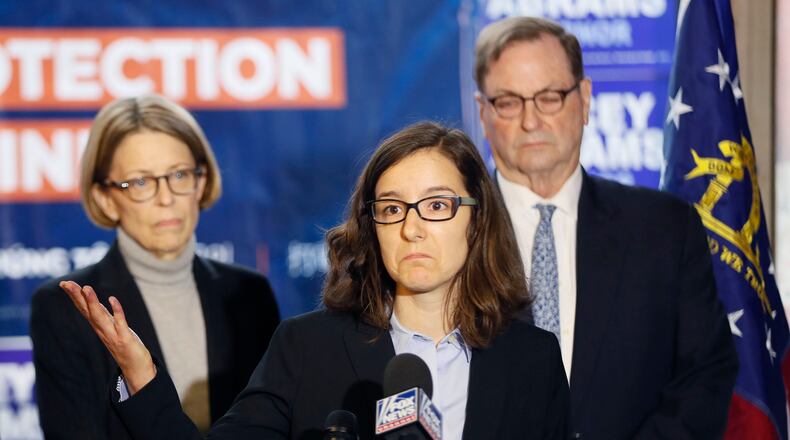 Lauren Groh-Wargo, Stacey Abrams' campaign manager, stands with attorneys at a Thursday press conference, discussing the Abrams campaign's pending legal actions. BOB ANDRES / BANDRES@AJC.COM