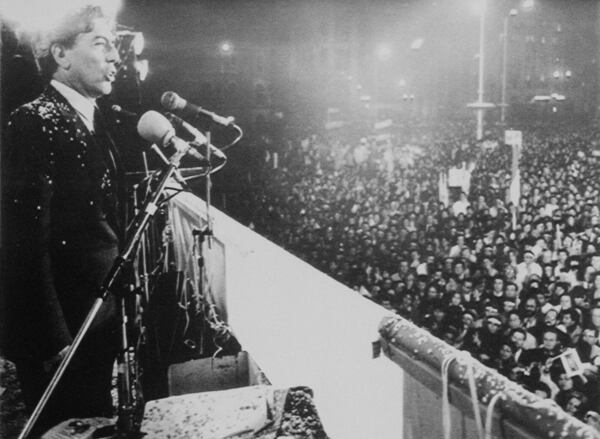 FILE - Writer Mario Vargas Llosa speaks at a rally in Lima, Peru, Aug. 21, 1987, to a crowd of more than 50,000 people. (AP Photo/A. Balaguer, File)