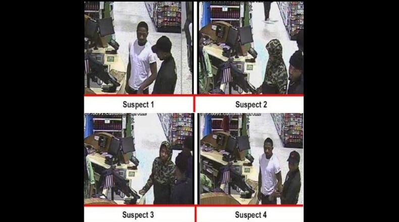 Gwinnett County police are seeking these four men caught on surveillance video at a Home Depot in Norcross. (Credit: Gwinnett County Police Department)