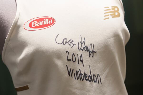 The 2019 dress worn by Coco Gauff on display in the No. 1 Court player walk-on entrance at the All England Lawn Tennis Club in Wimbledon, London, Wednesday July 2, 2025. (AELTC/Ben Queenborough via AP)
