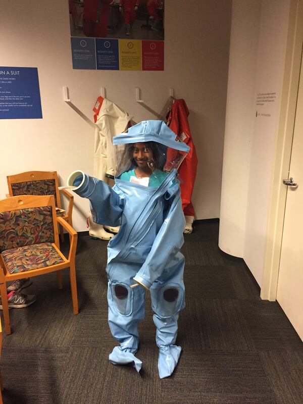 Rathna Malapati has always been passionate about becoming a doctor. She's seen here at 10 years old trying on a hazmat suit during a visit to the CDC Museum. (Courtesy of the Malapati family) 