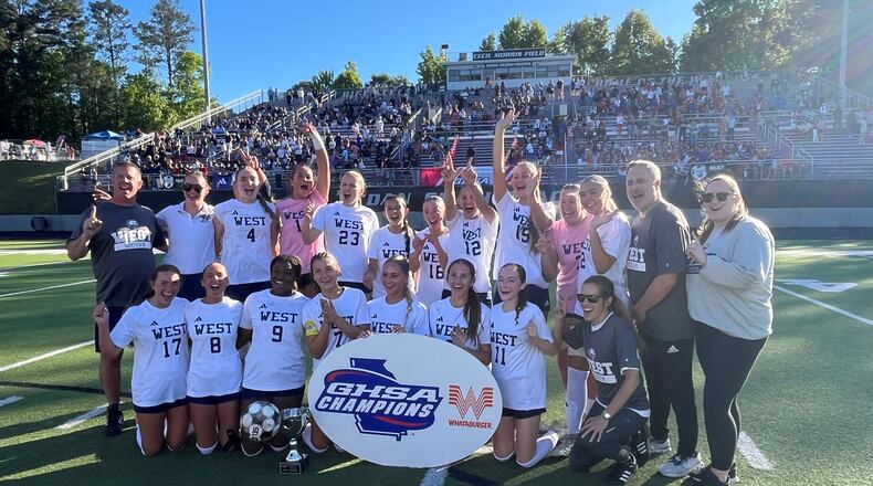 The West Forsyth team and coaches celebrate winning their fourth state title in six years, after beating Walton 2-1 in Thursday’s Class 6A girls’ championship game in Duluth.