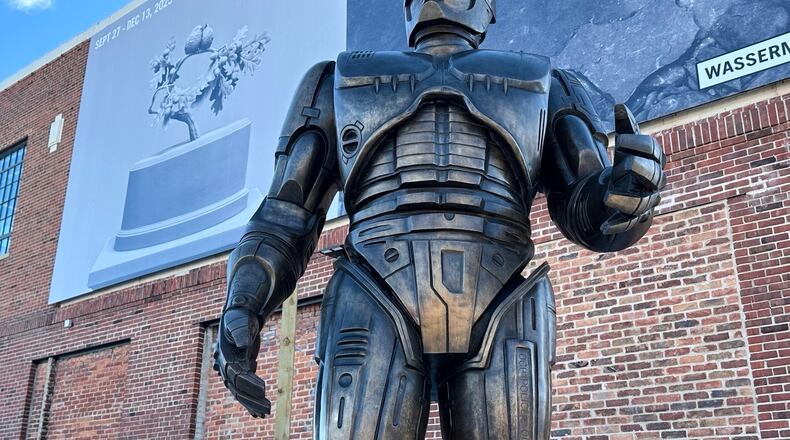 A statue of RoboCop stands outside a business in Detroit's Eastern Market area, Thursday, Dec. 4, 2025. (AP Photo/Mike Householder)