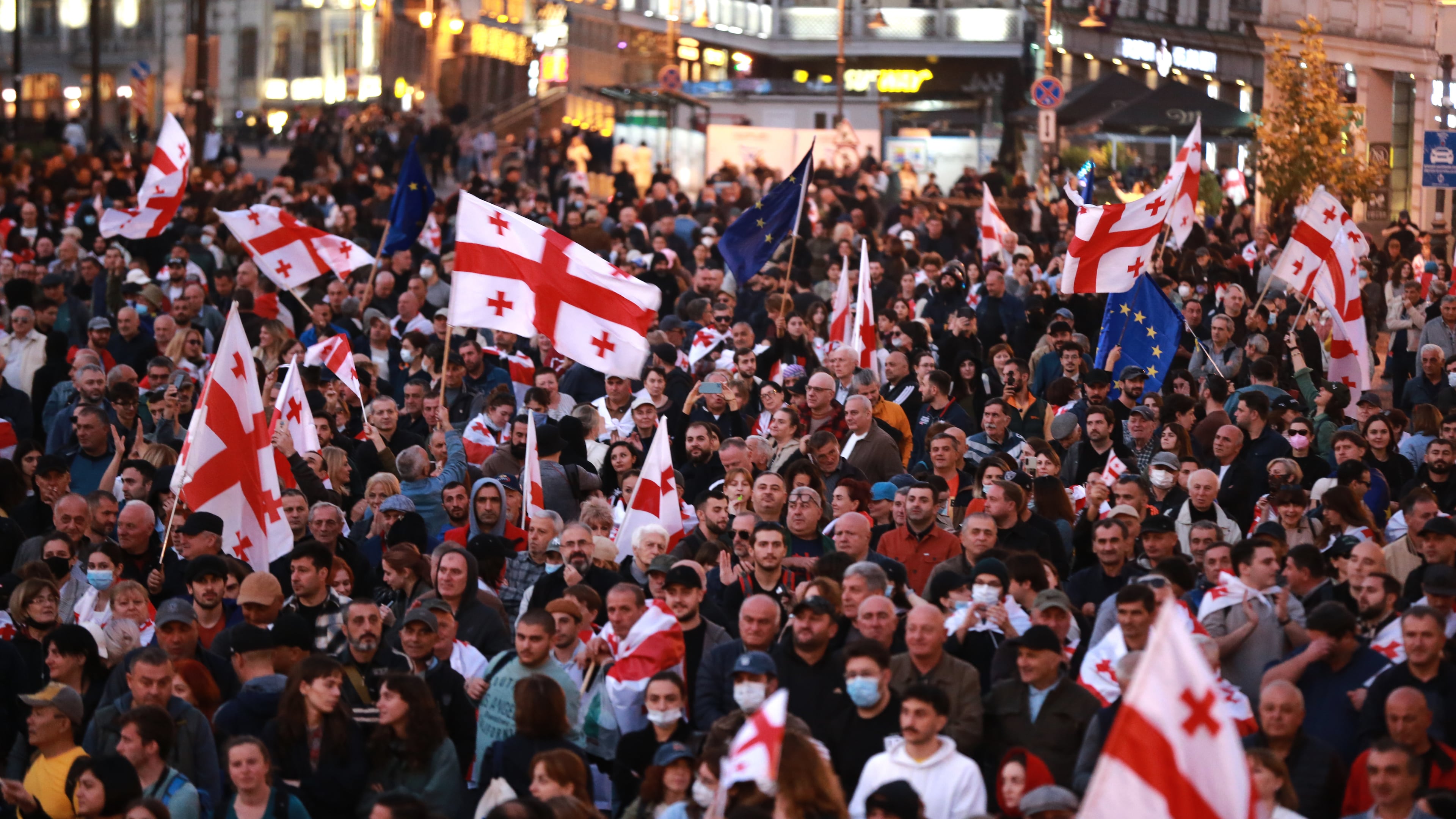 Opposition supporters with Georgian national and EU flags gather in the city center of Tbilisi, Georgia, on Saturday, Oct. 4, 2025, boycotting the municipal elections and call for the release of political opponents. (AP Photo/Zurab Tsertsvadze)