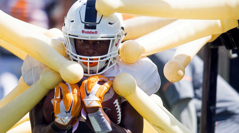 Tennessee running back Ty Chandler (3) participates in a drill  in Knoxville, Tenn. The Volunteers open the 2017 season in Atlanta against Georgia Tech.
