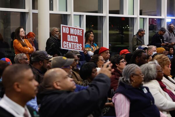 DeKalb residents attend a town hall held by Commissioner Ted Terry about an upcoming data center regulations vote at Porter Sanford III Performing Arts & Community Center in Decatur on Wednesday, Dec. 10, 2025. (Natrice Miller/AJC)