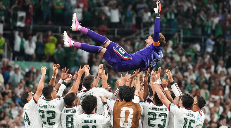 Mexico goalkeeper Guillermo Ochoa, top, celebrates with teammates following the World Cup Group A soccer match between Czechia and Mexico in Mexico City, Wednesday, June 24, 2026. (AP Photo/Fernando Llano)