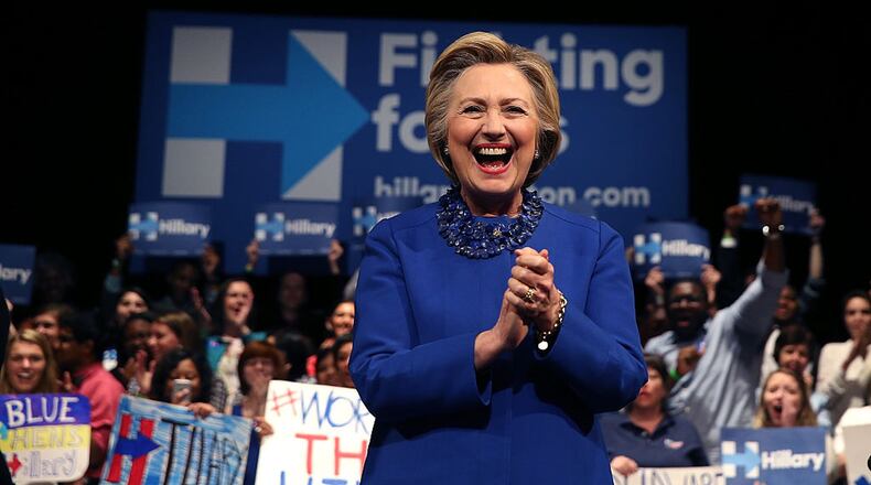 Democratic presidential candidate Hillary Clinton greets supporters during a Get Out the Vote rally at World Cafe Live at the Queen on April 25 in Wilmington, Del. Her smile is getting quite a bit of attention from male pundits who say she is either smiling too much or not enough. JUSTIN SULLIVAN / GETTY IMAGES