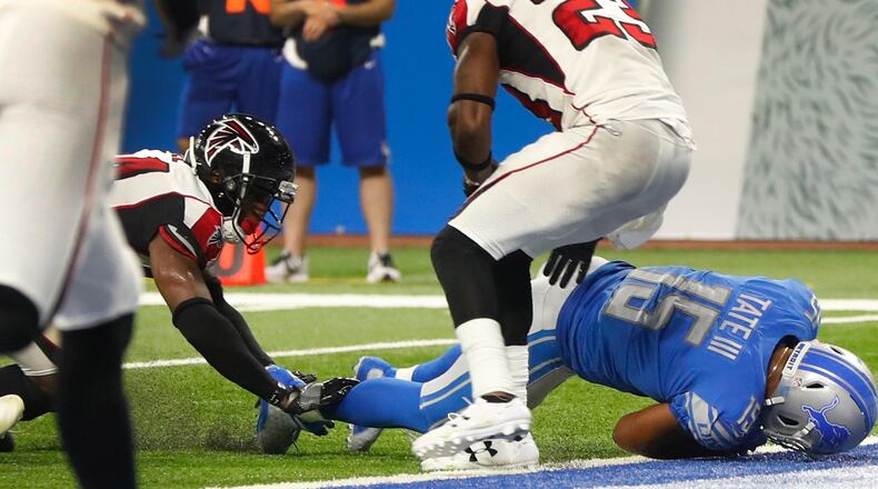 Detroit Lions wide receiver Golden Tate (15) falls into the end zone for a 1-yard touchdown reception during the second half of an NFL football game, Sunday, Sept. 24, 2017, in Detroit. The Replay Official reviewed the score ruling, and the play was reversed. After play reversal, referee rules a 10 second runoff and the game is over. The Falcons won 30-26. (AP Photo/Paul Sancya)
