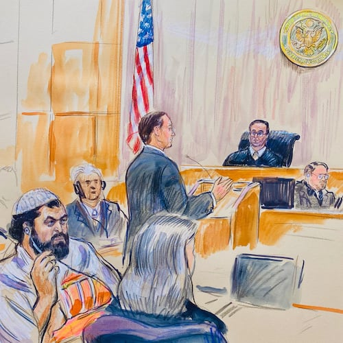 This courtroom sketch depicts Rahmanullah Lakanwal, 29, seated left, with defense attorney Michelle Peterson, seated foreground, before U.S. District Judge Amit Mehta, Feb. 4, 2025 at Federal Court in Washington, as Assistant U.S. Attorney Christopher Tortorice speaks at the podium. (Dana Verkouteren via AP)