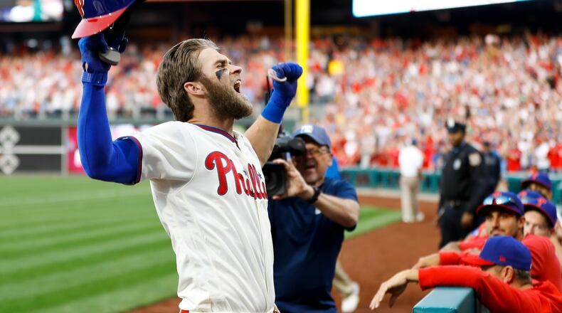 Philadelphia Phillies' Bryce Harper celebrates after hitting a home run off Atlanta Braves relief pitcher Jesse Biddle during the seventh inning. (AP Photo/Matt Slocum)