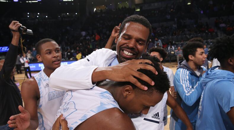 March 10, 2018 - Atlanta, Ga: Meadowcreek coach Curtis Gilleylen celebrates with forward Amari Kelly after their win against Norcross during the GHSA Class AAAAAAA Boys State Championship at McCamish Pavilion Saturday, March 10, 2018, in Atlanta. Meadowcreek won 56-43. PHOTO / JASON GETZ