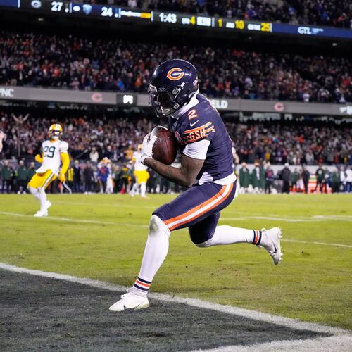 Chicago Bears' DJ Moore catches a touchdown pass during the second half of an NFL wild-card playoff football game against the Green Bay Packers Saturday, Jan. 10, 2026, in Chicago. (AP Photo/Nam Huh)