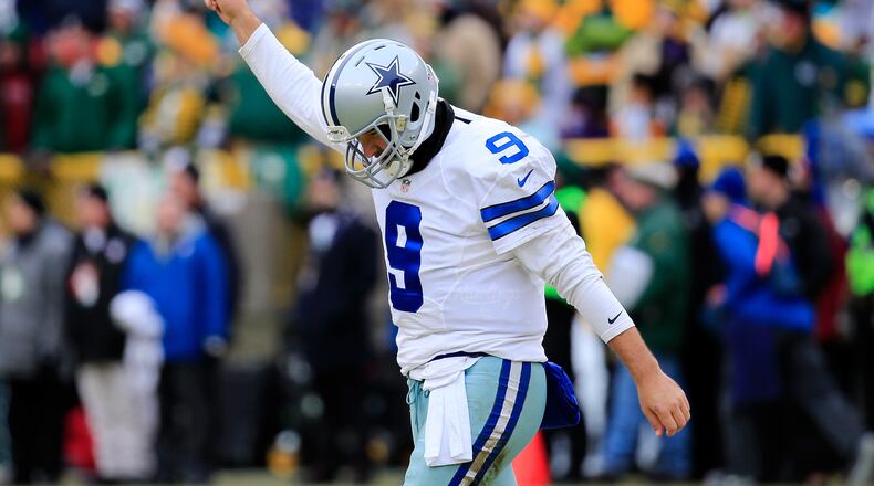 GREEN BAY, WI - JANUARY 11: Quarterback Tony Romo #9 of the Dallas Cowboys reacts after the Cowboys scored against the Green Bay Packers in the second qaurter of the 2015 NFC Divisional Playoff game at Lambeau Field on January 11, 2015 in Green Bay, Wisconsin. (Photo by Rob Carr/Getty Images)
