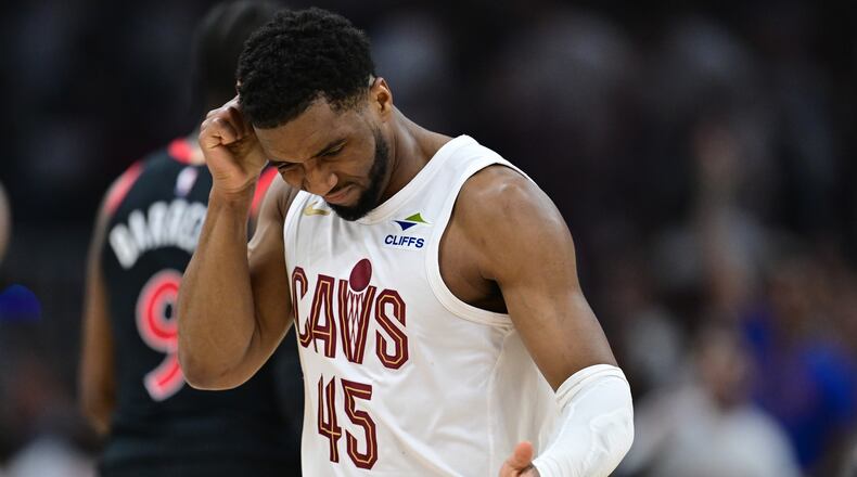 Cleveland Cavaliers guard Donovan Mitchell reacts after making a three point basket during the first half in Game 5 of a first-round NBA playoffs basketball series against the Toronto Raptors, Wednesday, April 29, 2026, In Cleveland. (AP Photo/David Dermer)