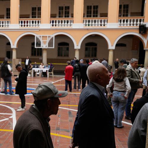 Voters line up at a polling station during the presidential election in Bogota, Colombia, Sunday, May 31, 2026. (AP Photo/Matias Delacroix)