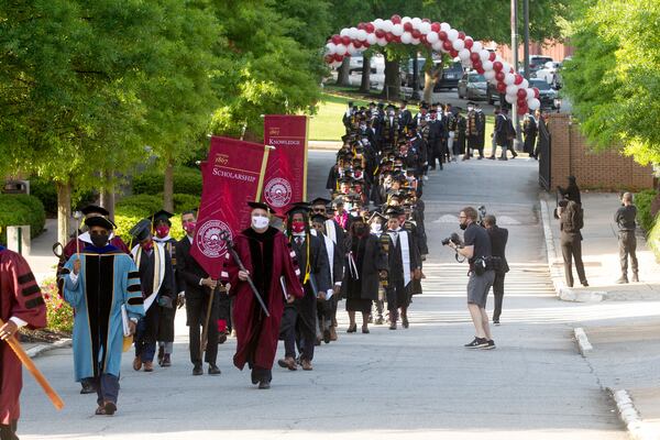 Graduates march to Century Campus at Morehouse College for the 137th commencement that celebrates the classes of 2020 and 2021 on Sunday, May 16, 2021. (Photo: Steve Schaefer for The Atlanta Journal-Constitution)