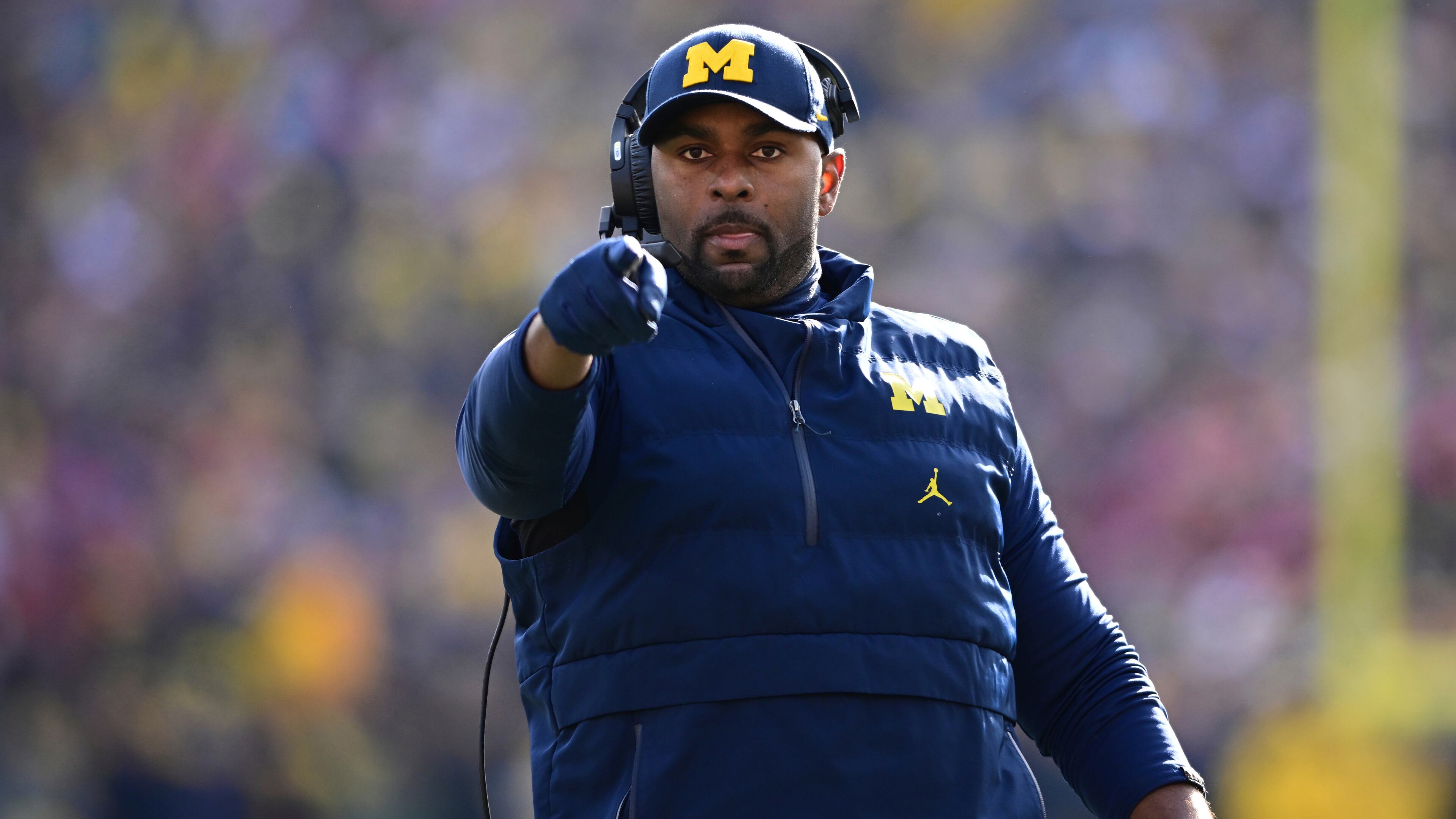 FILE - Michigan acting head coach Sherrone Moore reacts to a video replay during the first half of an NCAA college football game against Ohio State, Saturday, Nov. 25, 2023, in Ann Arbor, Mich. (AP Photo/David Dermer, File)