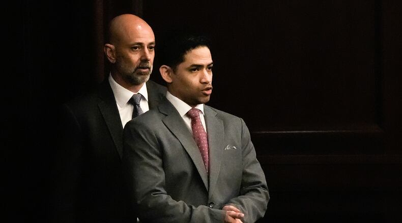 Defense Attorney James Hill, left walks in his client, defendant Mario Fernandez Saldana, during his trial on Tuesday, Aug. 25, 2026 at the Duval Count Courthouse in Jacksonville, Fla. [Doug Engle/The Florida Times-Union via AP, Pool)