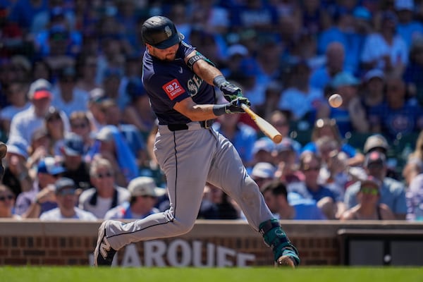 Seattle Mariners' Cal Raleigh hits a two-run home run during the seventh inning of a baseball game against the Chicago Cubs, Friday, June 20, 2025, in Chicago. (AP Photo/Erin Hooley)