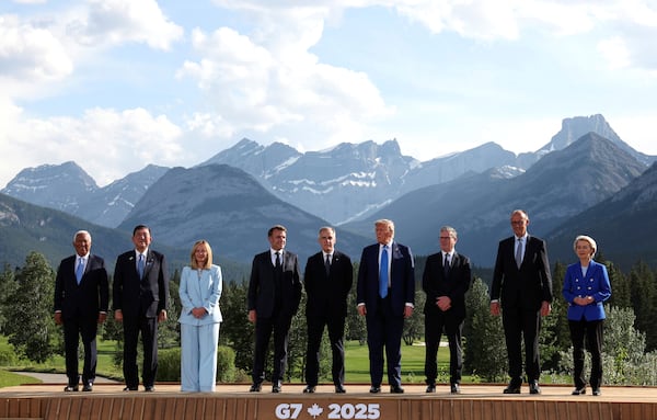 European Council President Antonio Costa, from left, Japan's Prime Minister Shigeru Ishiba, Italian Prime Minister Giorgia Meloni, French President Emmanuel Macron, Canada's Prime Minister Mark Carney, U.S. President Donald Trump, Britain's Prime Minister Keir Starmer, German Chancellor Friedrich Merz and European Commission President Ursula von der Leyen pose for a family photo during the G7 Summit, in Kananaskis, Alberta, Monday, June 16, 2025. (Suzanne Plunkett/Pool Photo via AP)