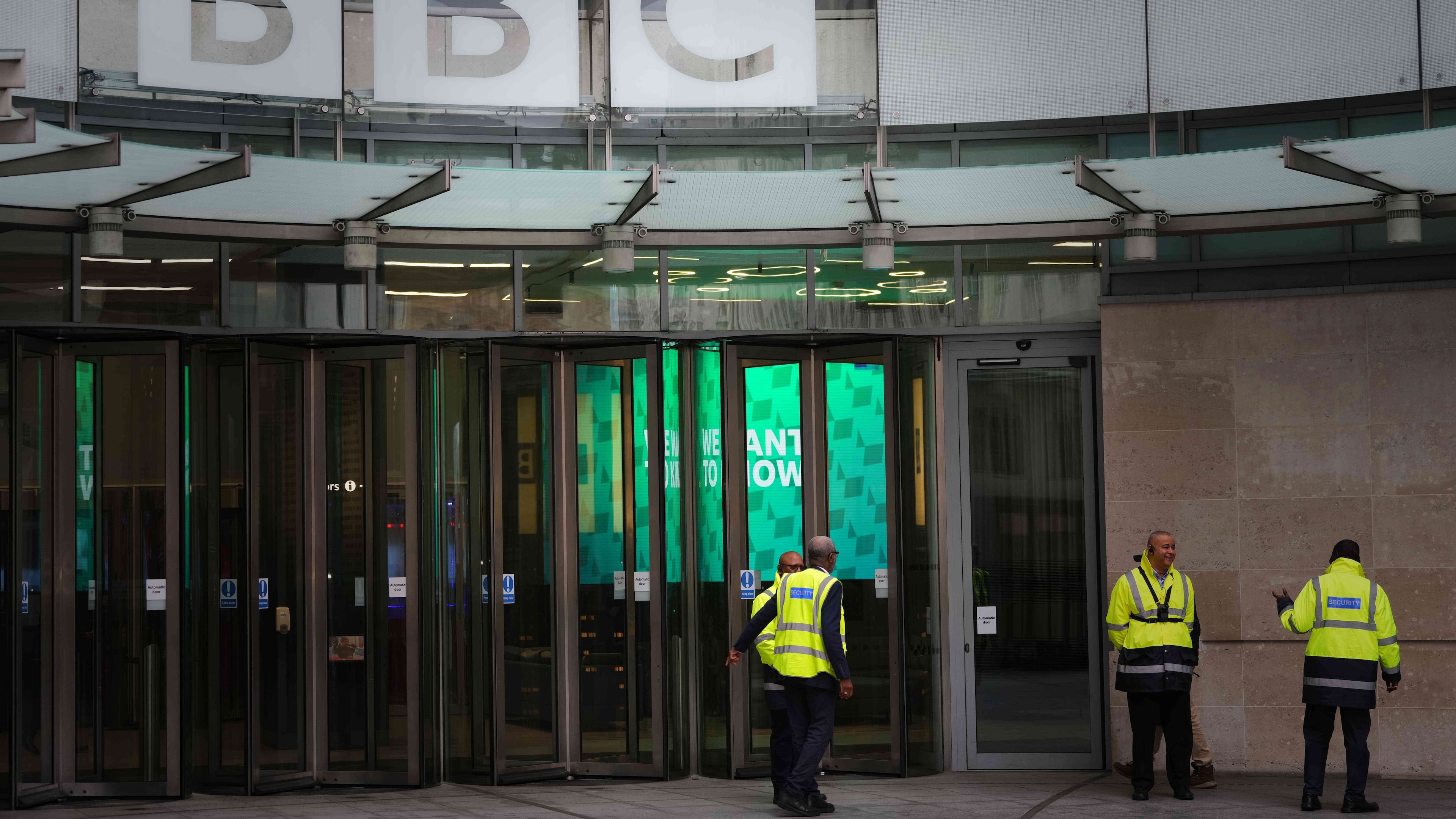 Security guards outside BBC Broadcasting House in London, Tuesday, Nov. 11, 2025. (AP Photo/Kirsty Wigglesworth)