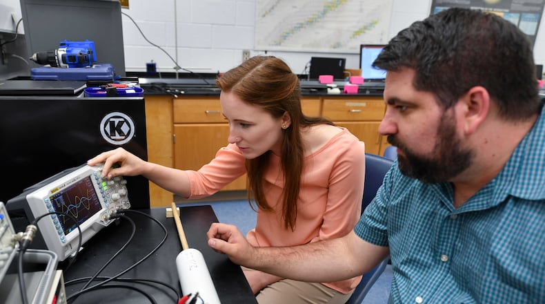 Berry College physics major Alexandria Skinner (left), works on a research project with physics professor Shawn Hilbert (right). Skinner has secured a job teaching Physics and Earth Science at a charter school in Arizona. Photo Credit: Brant Sanderlin / Berry College.